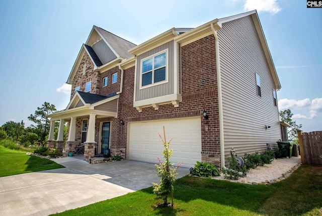 view of front of property with a front yard and a garage