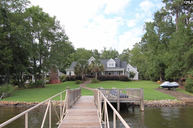 dock area featuring a water view and a yard