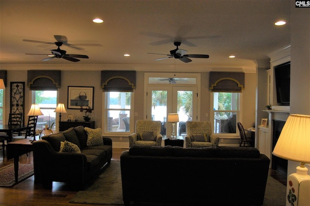 living room with dark hardwood / wood-style floors, ceiling fan, french doors, and crown molding