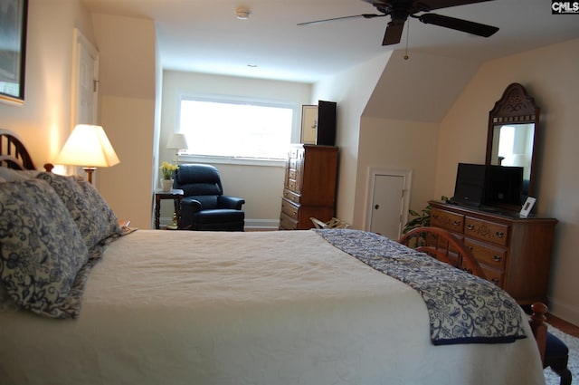 bedroom with lofted ceiling and ceiling fan