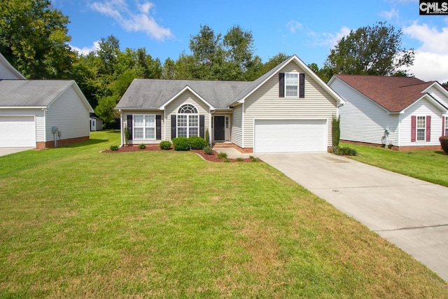 view of front of house with a front yard and a garage