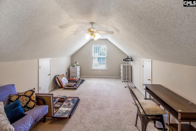 bonus room with lofted ceiling, light colored carpet, ceiling fan, and a textured ceiling
