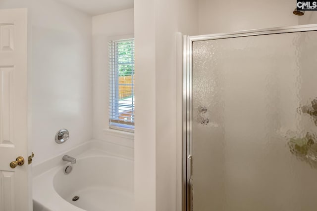 bathroom featuring plus walk in shower