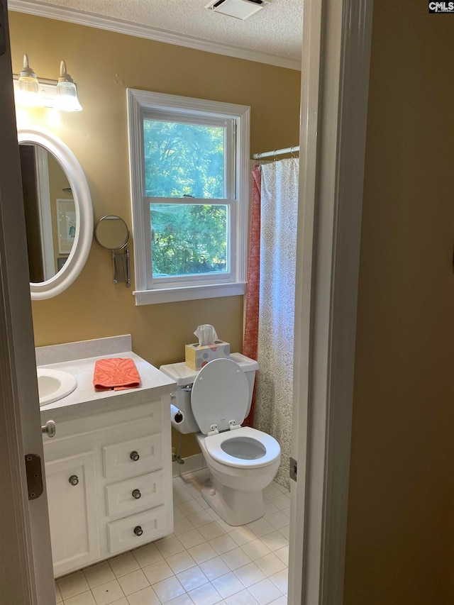 bathroom featuring tile flooring, a textured ceiling, toilet, vanity, and crown molding