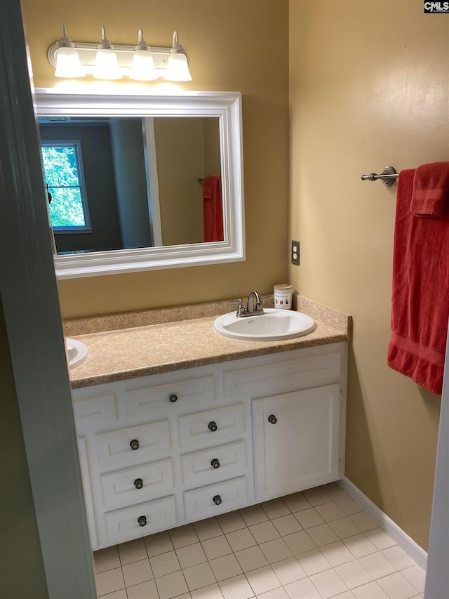 bathroom with tile flooring and vanity