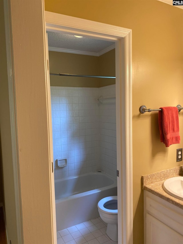 full bathroom featuring tiled shower / bath combo, toilet, tile flooring, a textured ceiling, and vanity