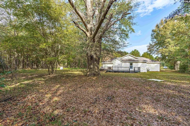 view of yard with a deck