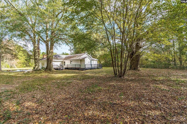 view of yard with a deck