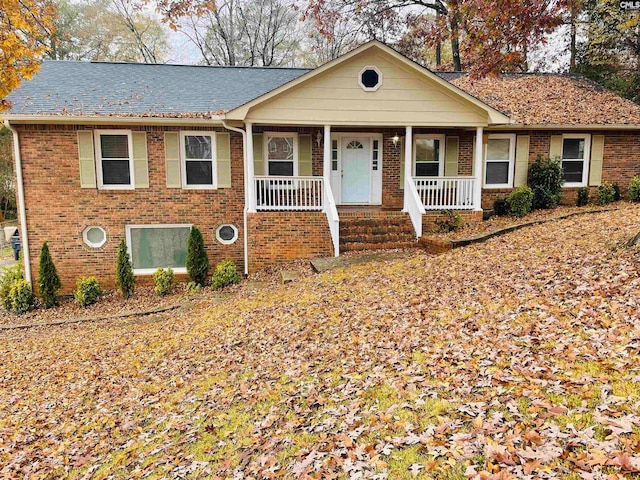 ranch-style home featuring covered porch