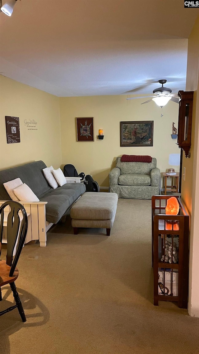 interior space with ceiling fan and carpet floors