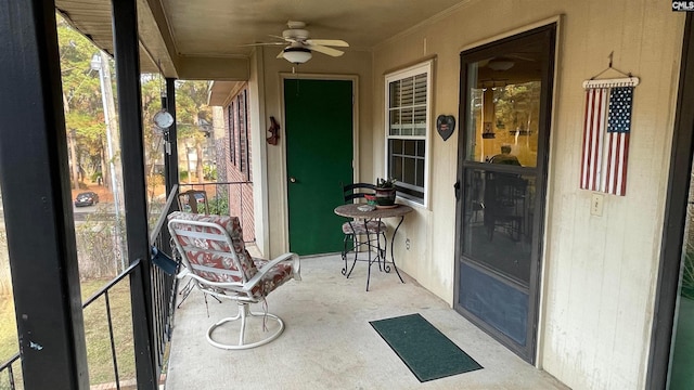 sunroom / solarium featuring ceiling fan