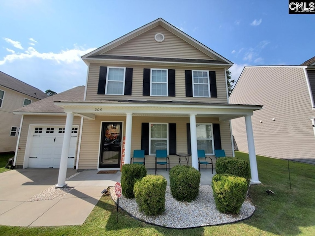 view of front of property with a front lawn, a porch, and a garage