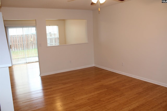 unfurnished room with ceiling fan and light wood-type flooring