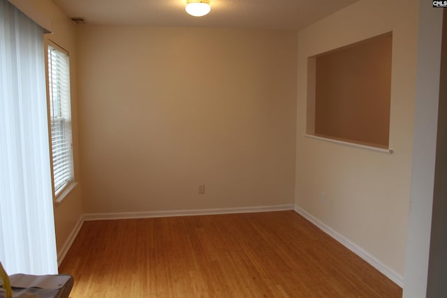 spare room with light wood-type flooring