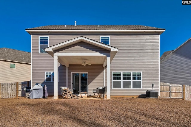 back of property featuring ceiling fan and central AC unit