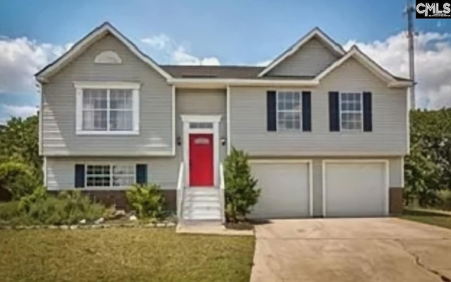 split foyer home featuring a garage