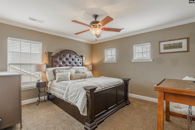 carpeted bedroom with crown molding and ceiling fan