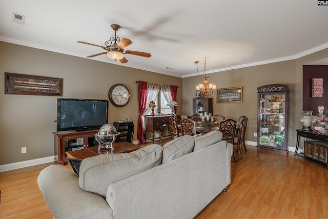 living room featuring crown molding, light hardwood / wood-style flooring, and ceiling fan with notable chandelier