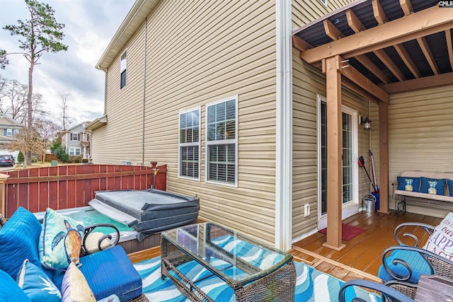 exterior space featuring outdoor lounge area and a covered hot tub