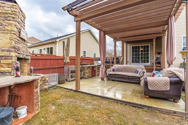 view of patio featuring a pergola and an outdoor bar