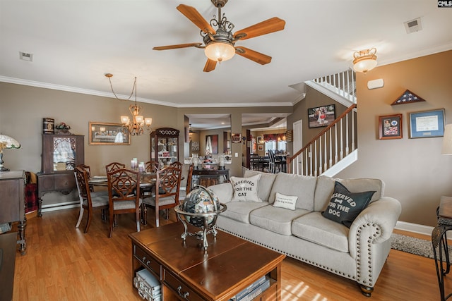 living room with light hardwood / wood-style flooring, crown molding, and ceiling fan with notable chandelier