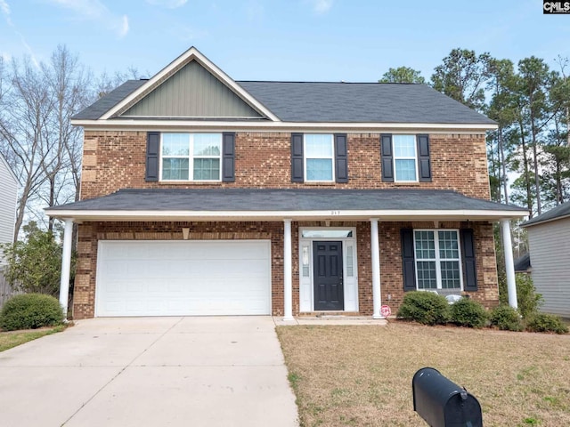 view of front of property featuring a front lawn and a garage