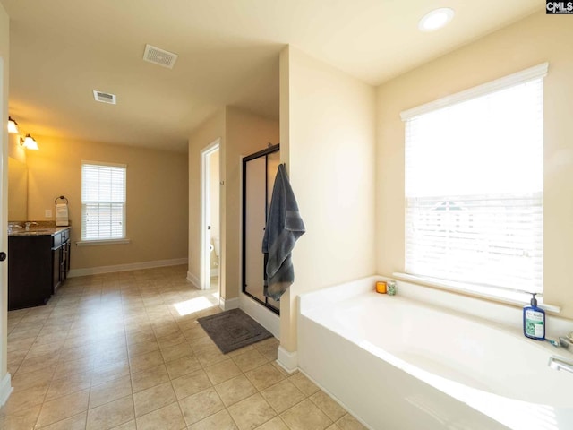 bathroom featuring vanity, tile floors, and independent shower and bath