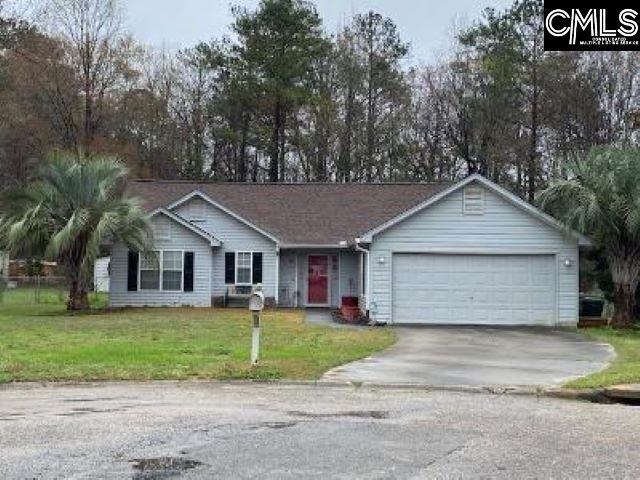 single story home featuring a front yard and a garage