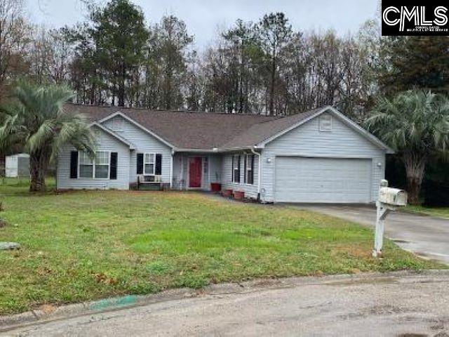 single story home featuring a front yard and a garage