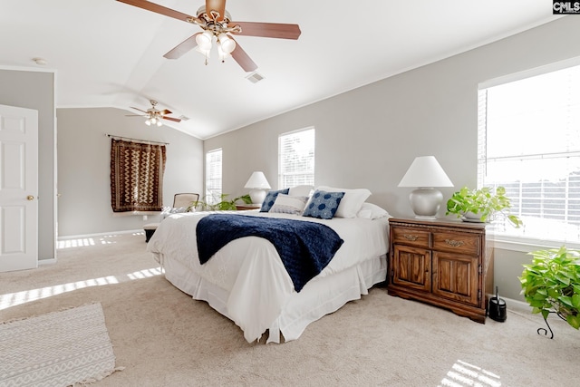 carpeted bedroom featuring ceiling fan and vaulted ceiling