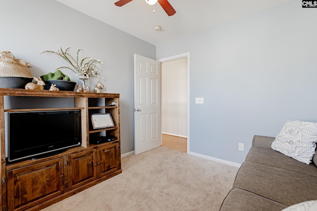 interior space featuring light carpet and ceiling fan