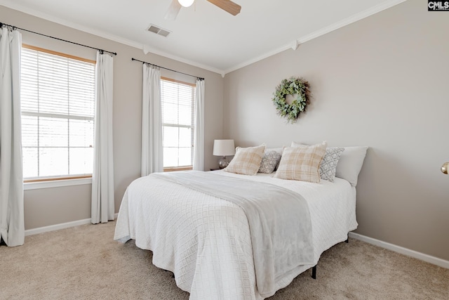 carpeted bedroom featuring crown molding, ceiling fan, and multiple windows