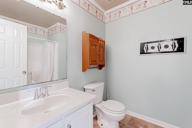 bathroom with toilet, tile floors, and vanity