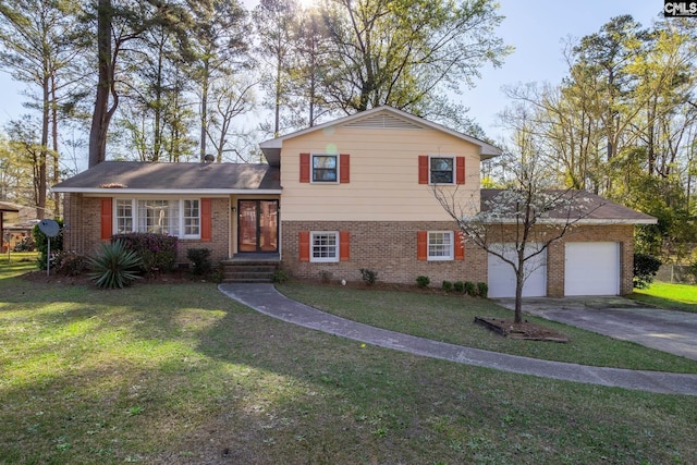 tri-level home featuring a front yard and a garage