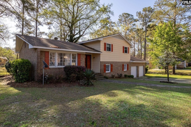 view of front facade with a front yard and a garage