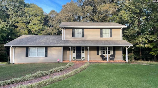 view of front of property with a porch and a front lawn