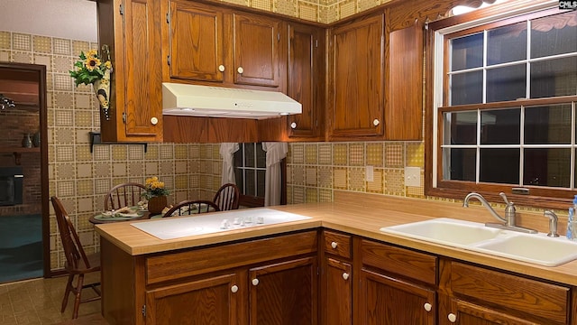 kitchen with tile flooring, sink, and backsplash