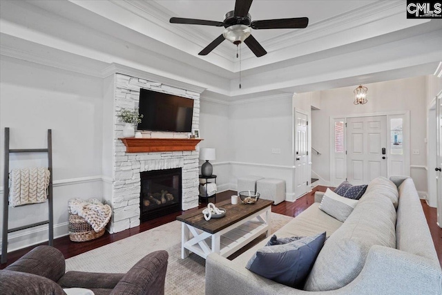 51 Swallowtail Ct, Columbia, SC 29229 - living room featuring ceiling fan, crown molding, dark wood-type flooring, and a stone fireplace