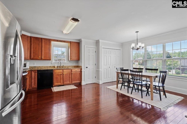 51 Swallowtail Ct, Columbia, SC 29229 - kitchen featuring an inviting chandelier, dark wood-type flooring, light stone counters, stainless steel fridge, and dishwasher