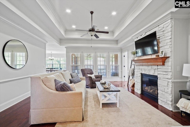 51 Swallowtail Ct, Columbia, SC 29229 - living room with dark wood-type flooring, a raised ceiling, a fireplace, ceiling fan with notable chandelier, and ornamental molding
