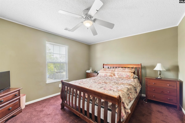 carpeted bedroom featuring ceiling fan and a textured ceiling