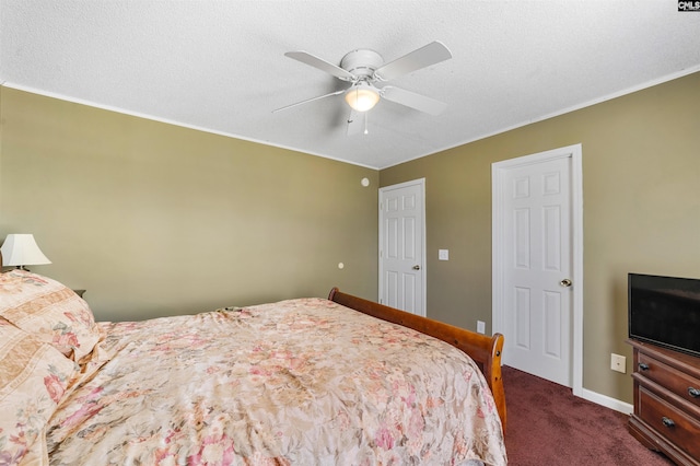 carpeted bedroom featuring ceiling fan and a textured ceiling