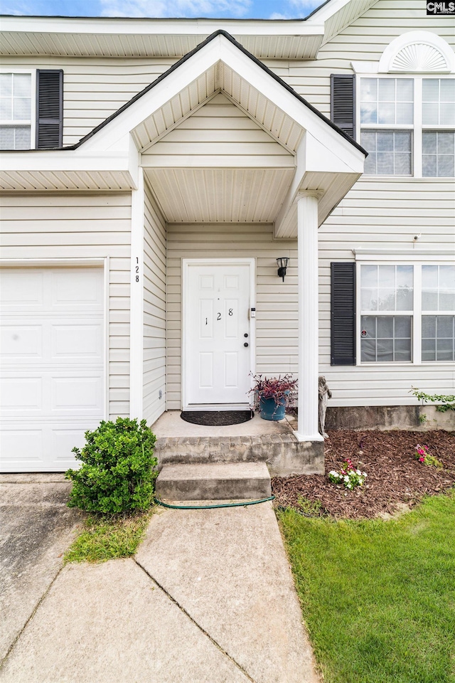 doorway to property featuring a garage