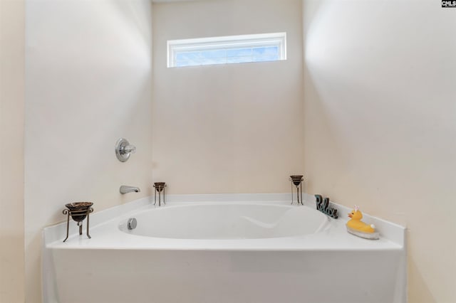 bathroom featuring a bath to relax in