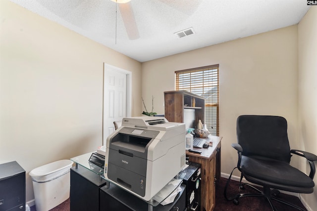 home office featuring ceiling fan and a textured ceiling