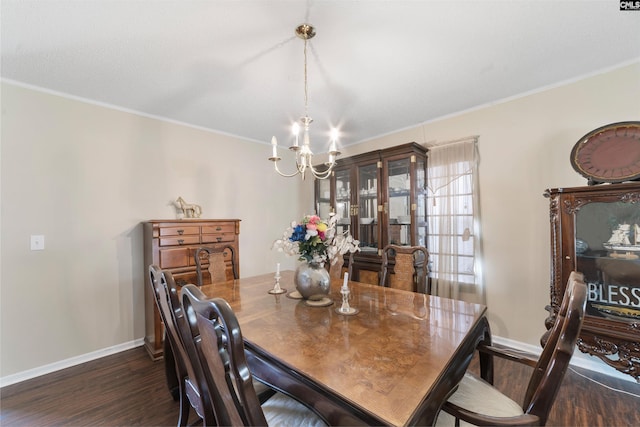 dining area with crown molding, an inviting chandelier, and dark hardwood / wood-style flooring