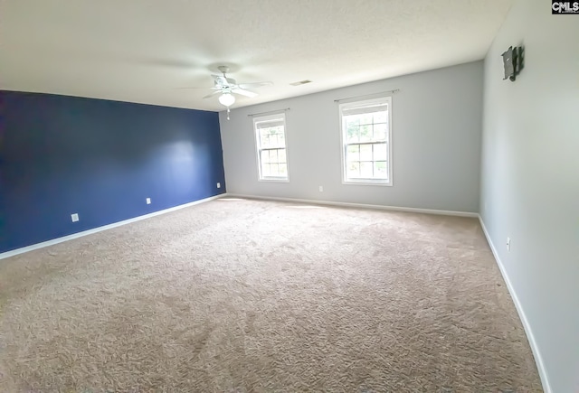 unfurnished room with light carpet and ceiling fan