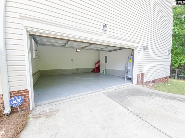 garage featuring a carport and water heater