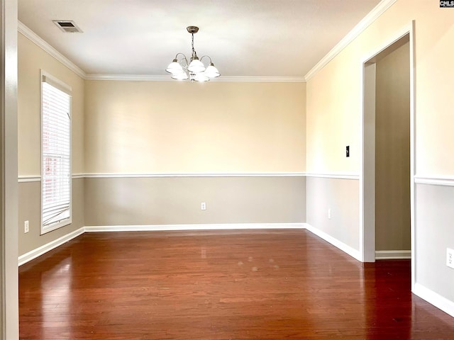 unfurnished room featuring dark hardwood / wood-style floors, ornamental molding, and a notable chandelier