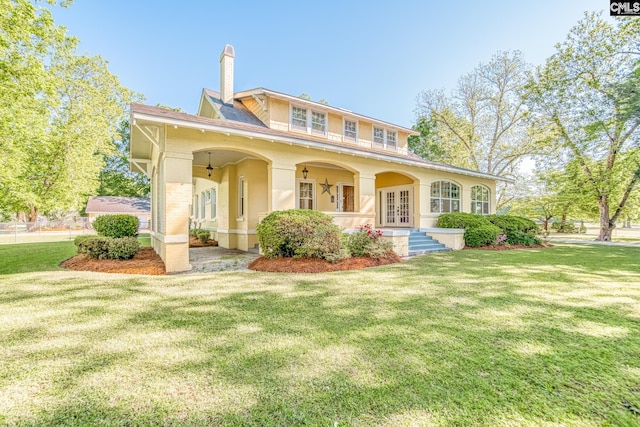 view of front of property featuring a porch and a front yard